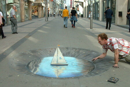 Dibujo que simula un charco con un barco de papel.